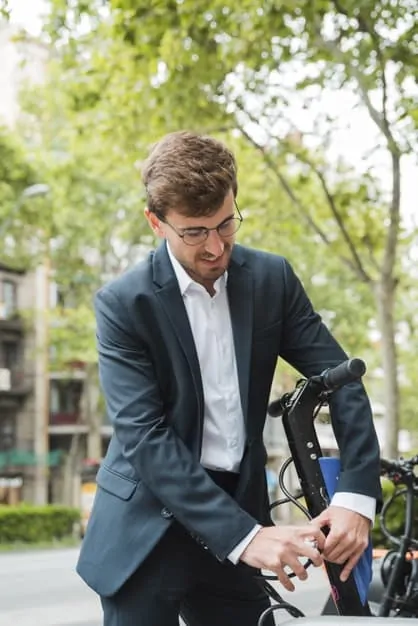 close-up-man-locking-electric-scooter