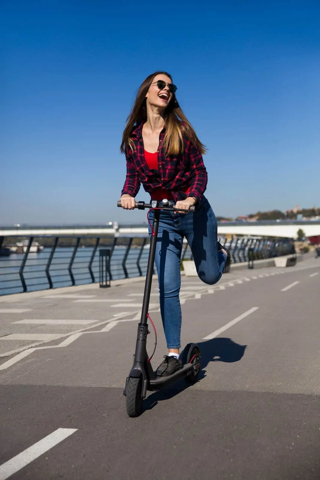 Best 5 Coolest Electric Scooters For Sale In 2020 Review - Smiling Riding on Electric Scooter